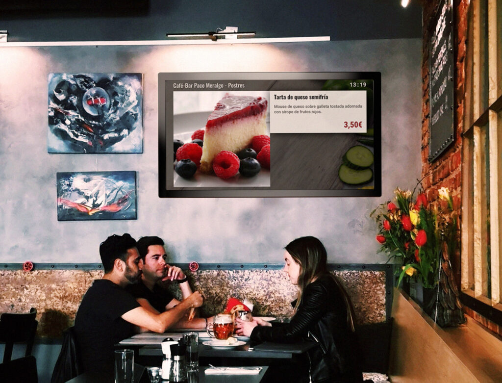 Restaurante utilizando cartelería digital en sus pantallas de TV